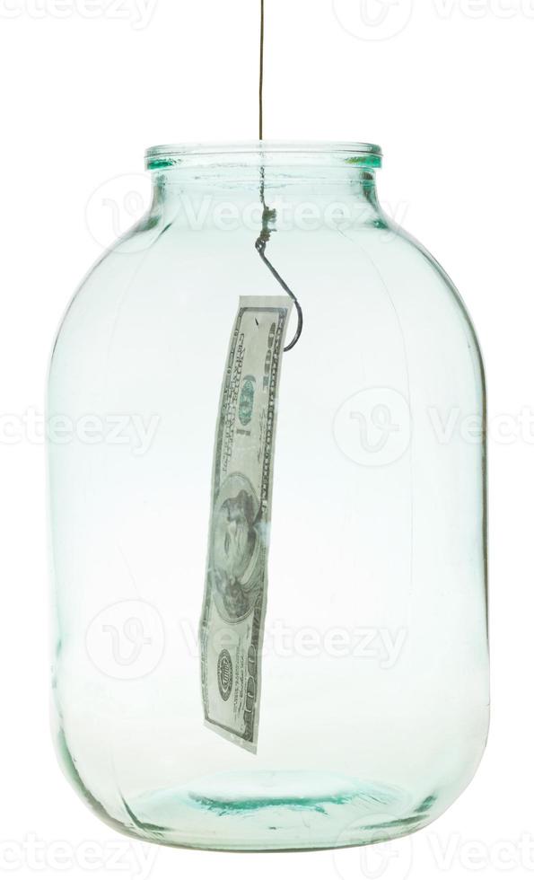 get out 100 dollars banknote from glass jar photo