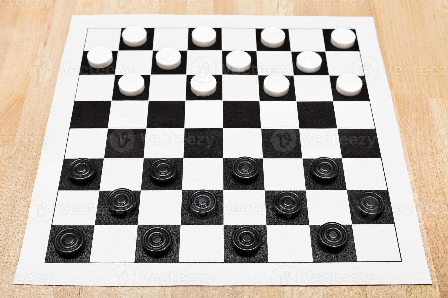 Starting position on vinyl draughts board photo