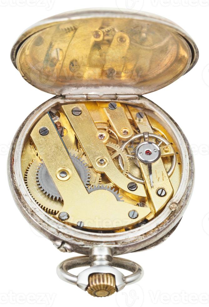 brass clockwork of vintage silver pocket watch photo