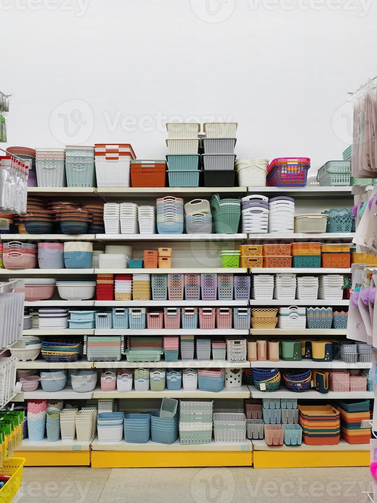 Colorful plastic storage boxes on the shelf for accessories. placed on the shelf in the store photo