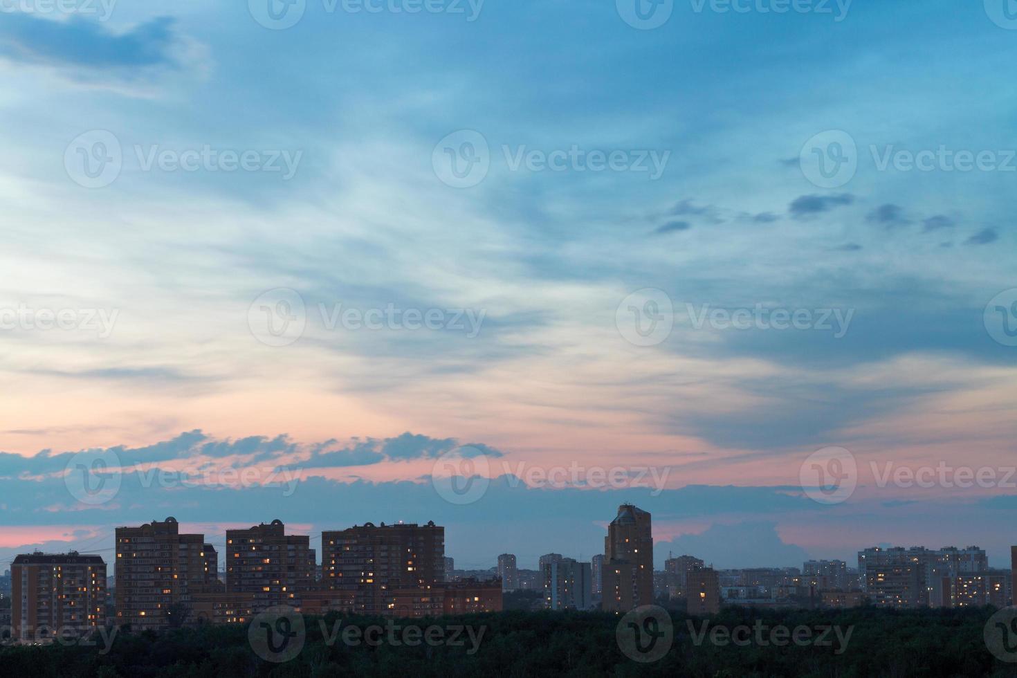 dark blue and pink night sky over urban street photo