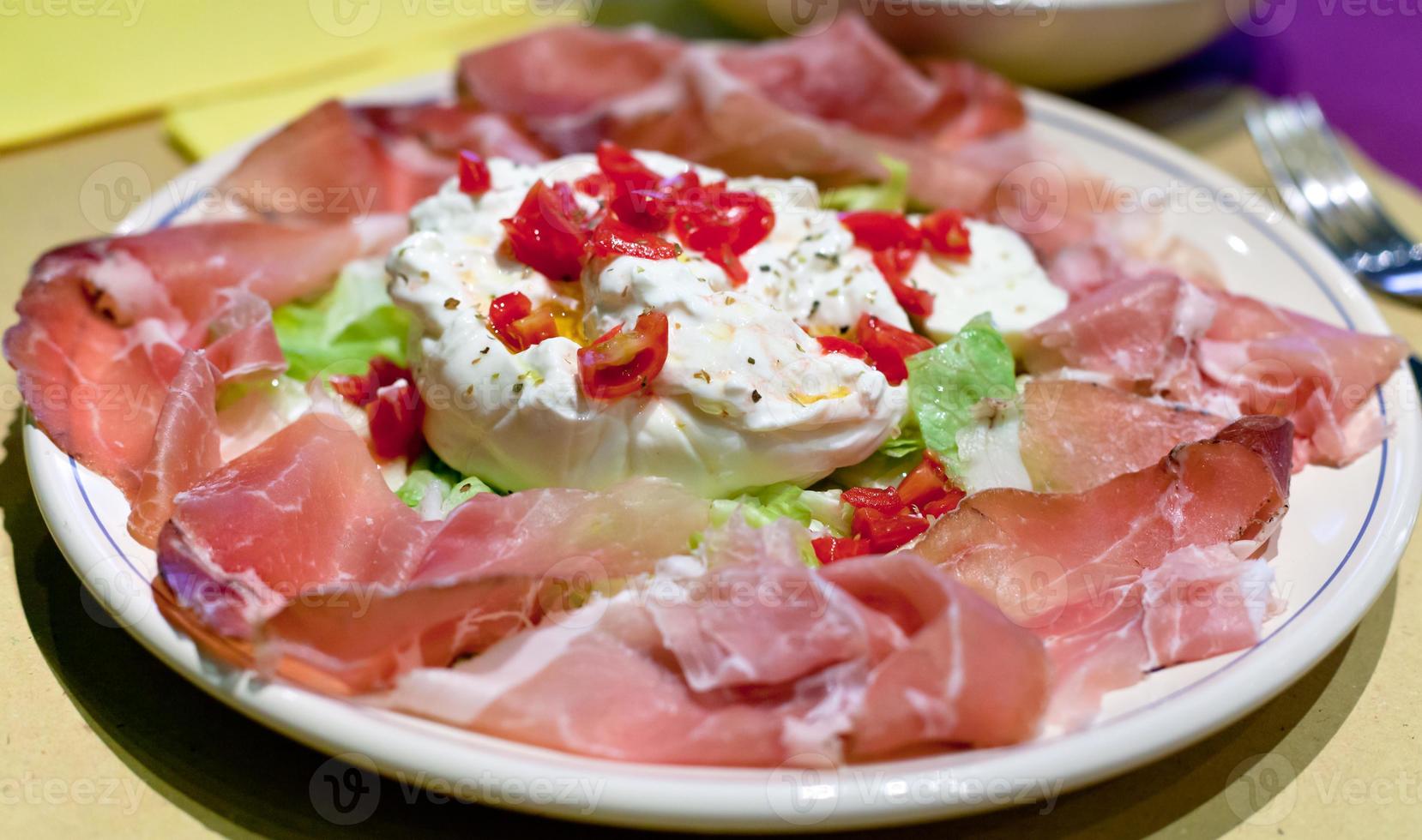 burrata with parma prosciutto crudo photo