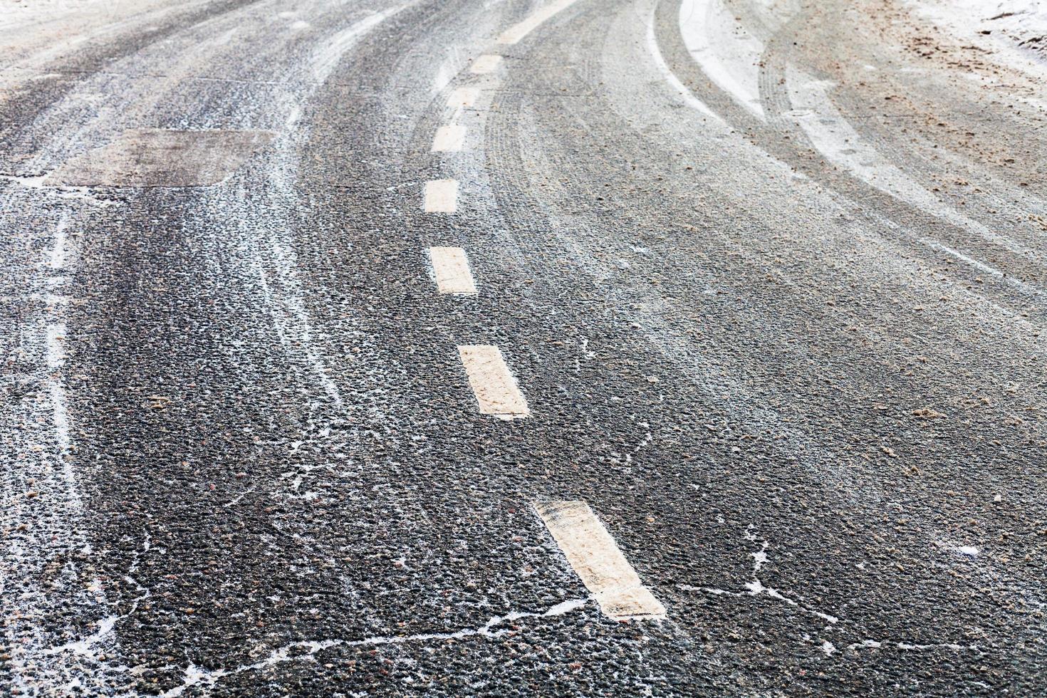 turn on a slippery frozen road in winter photo
