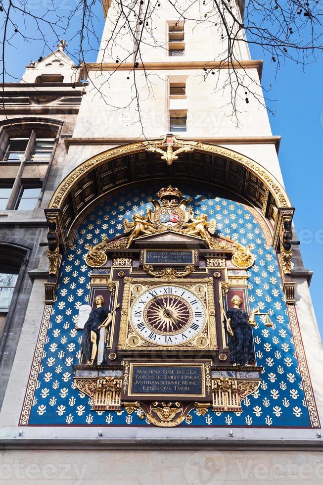 wall clock on Conciergerie tower in Paris photo