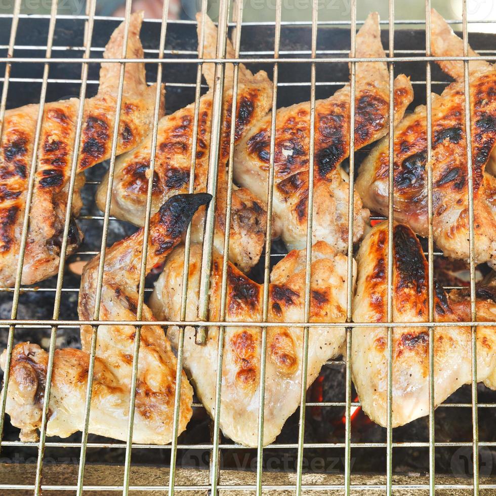 grilled chicken wings on brazier photo