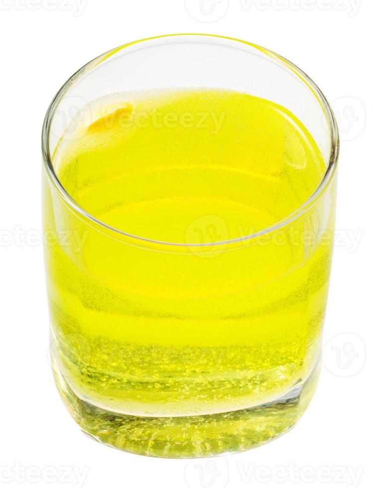 glass of yellow carbonated water with vitamin C photo