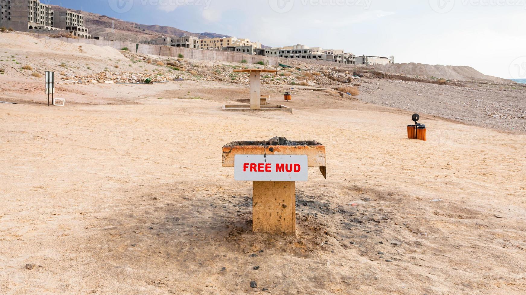 Tray with medicinal mud on beach of Dead Sea photo