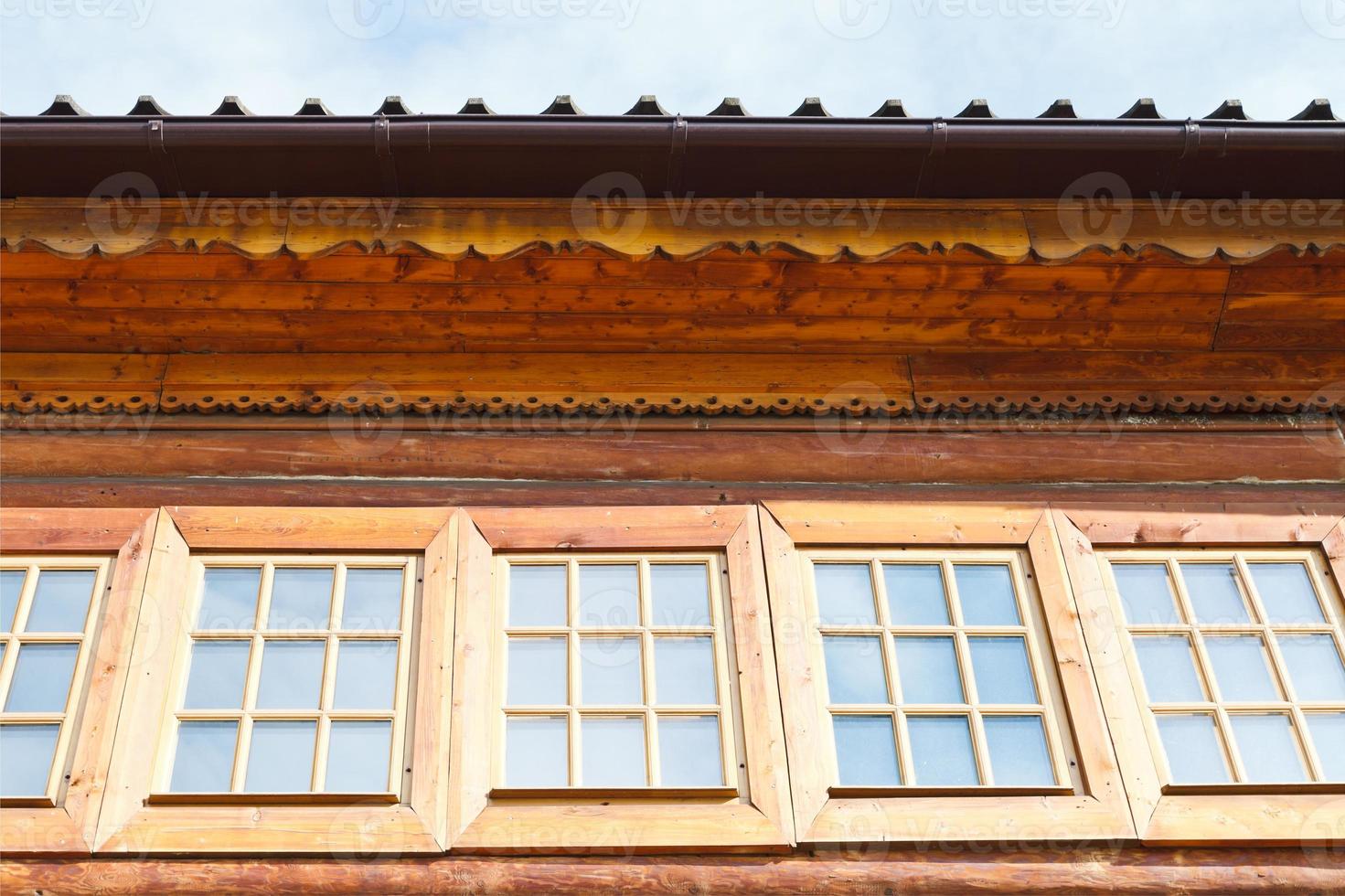 windows of wooden log house photo
