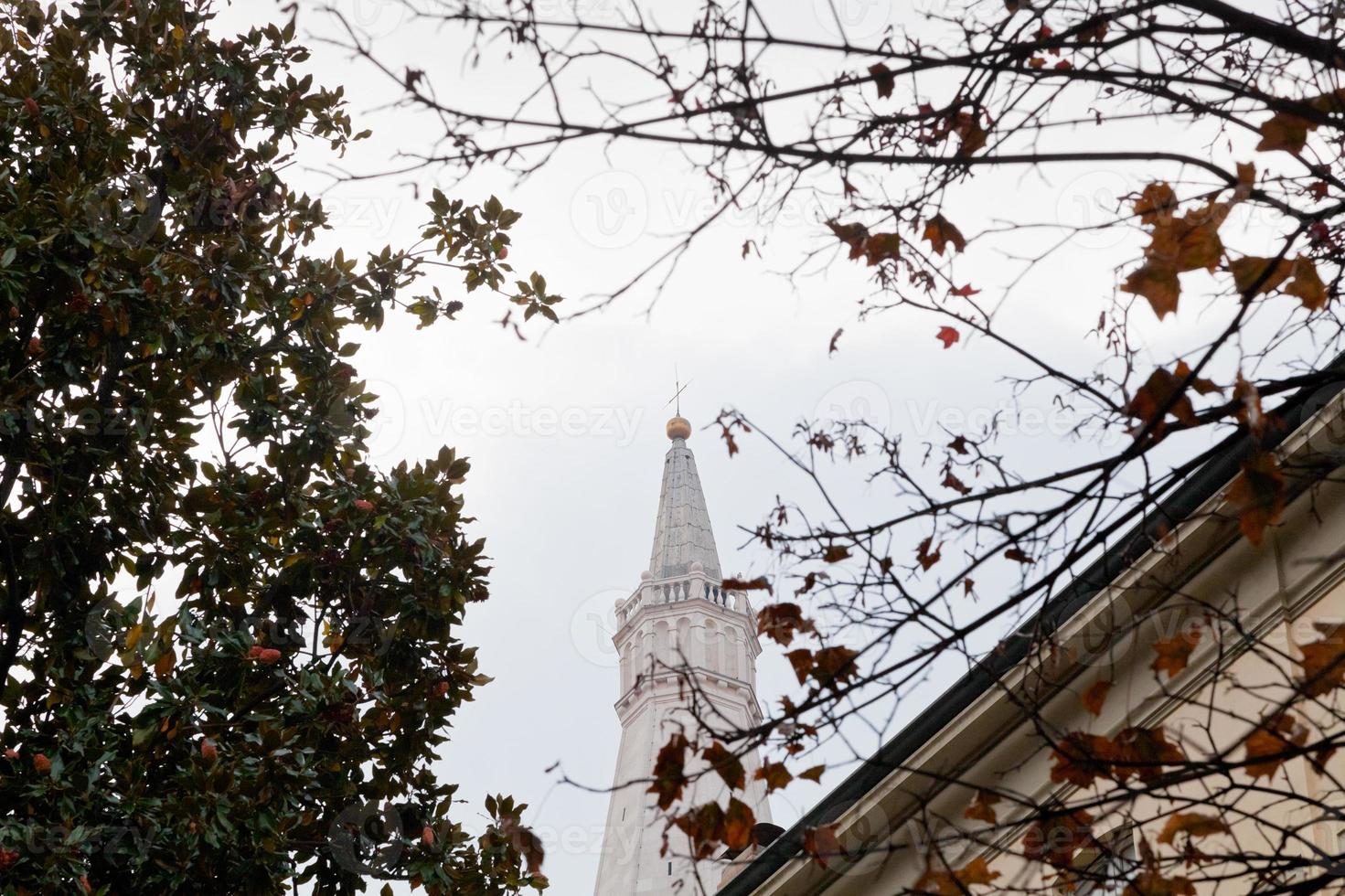 view of bell tower of Modena Cathedral, Italy in autumn photo