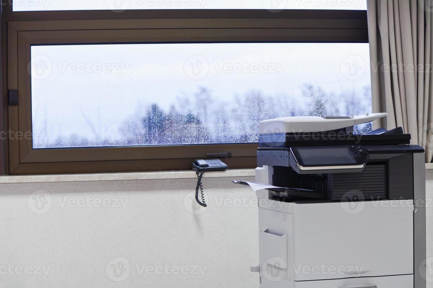 big grey copier in grey office photo