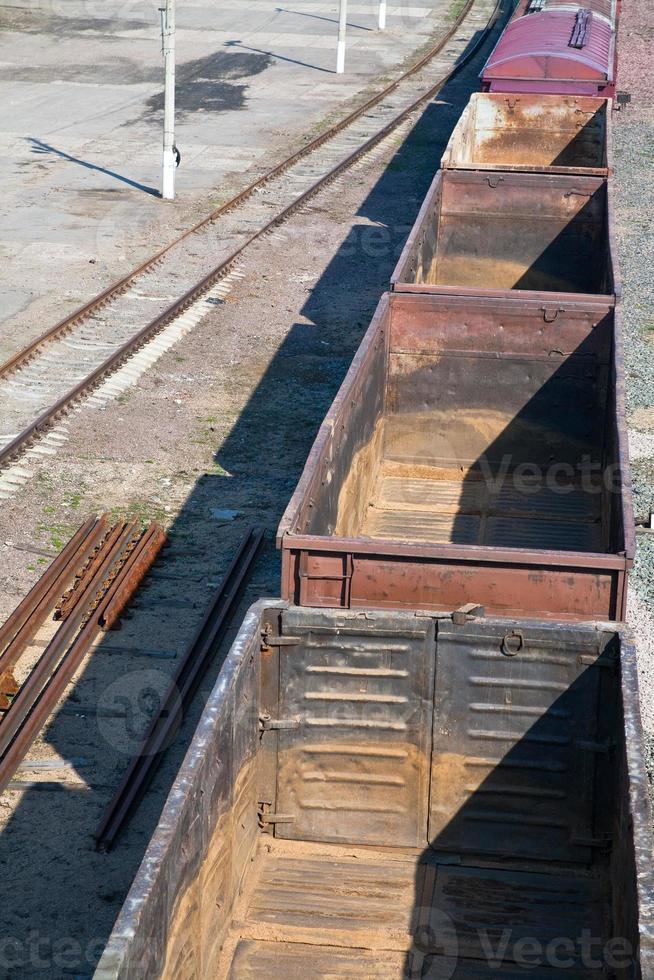 empty open freight cars on railroad photo