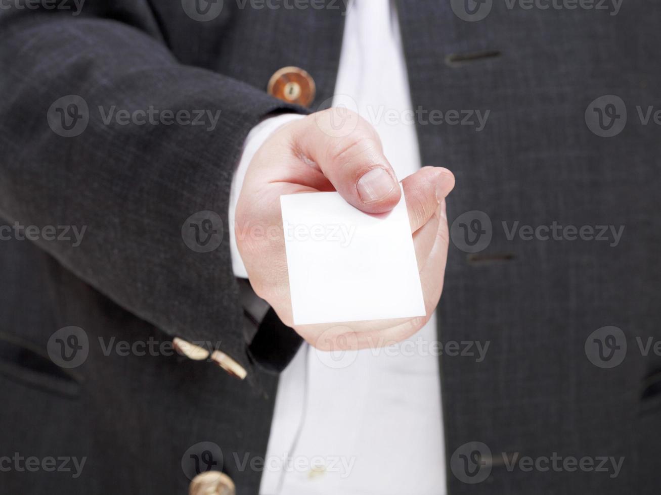 front view of blank business card in male hand photo