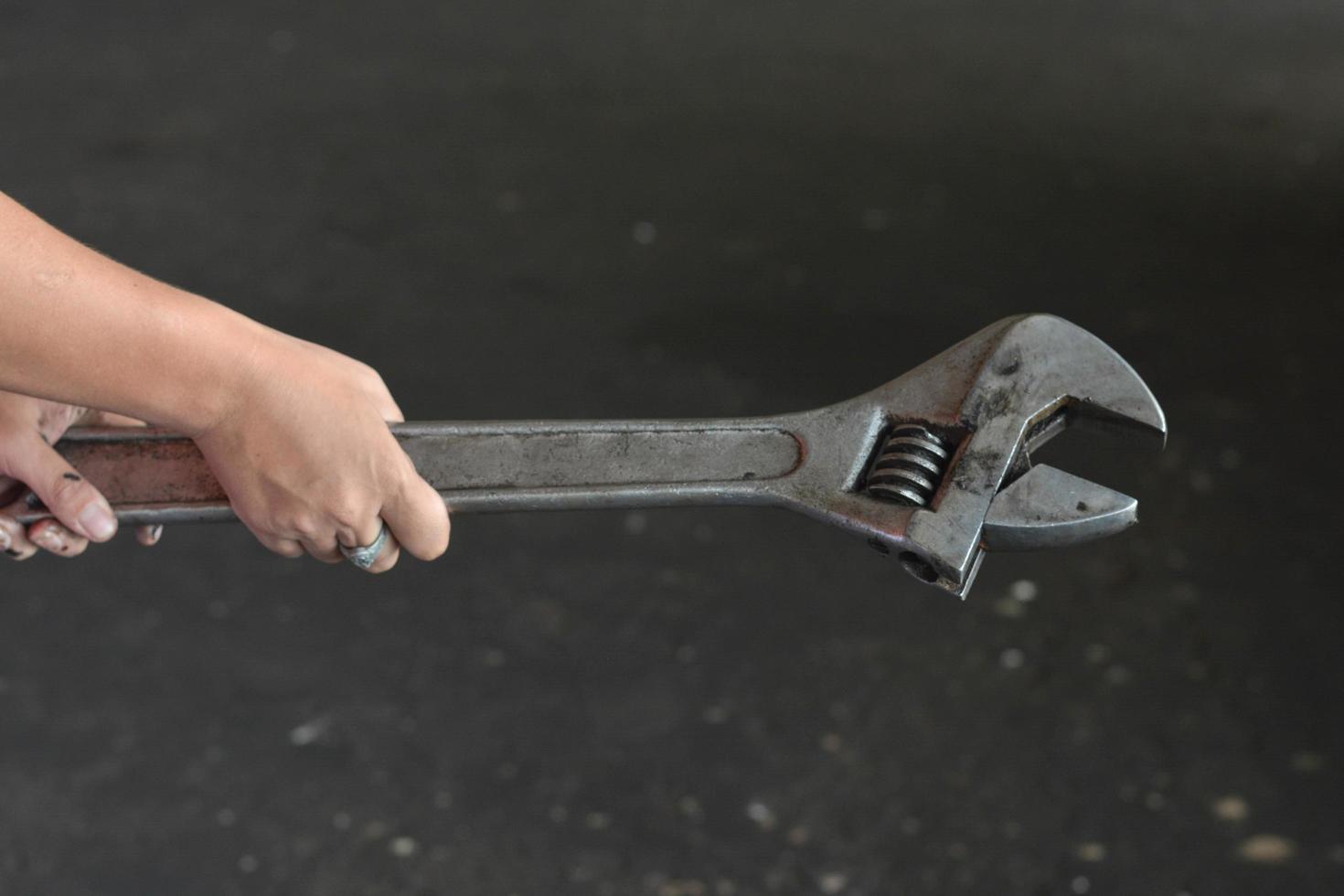 A portrait of some people holding hand tool maintenance. Such as wrench. photo