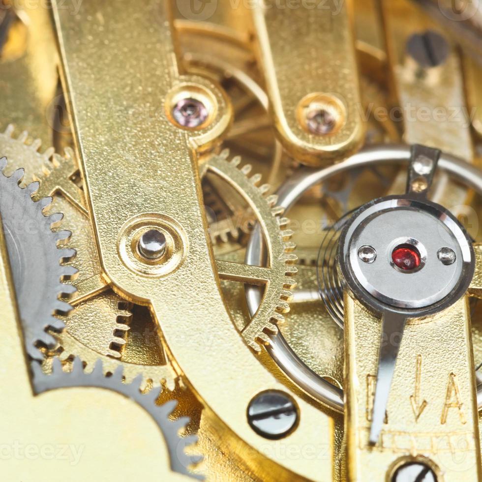 brass mechanical clockwork of vintage watch photo