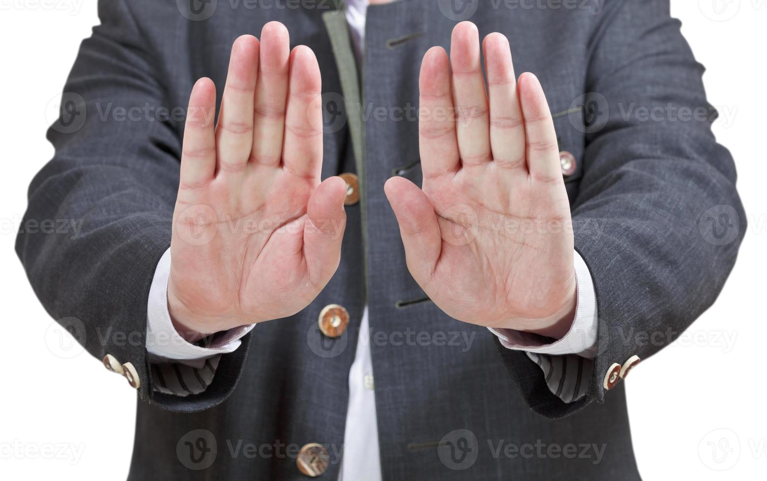 stop sign by two palms - businessman hand gesture photo