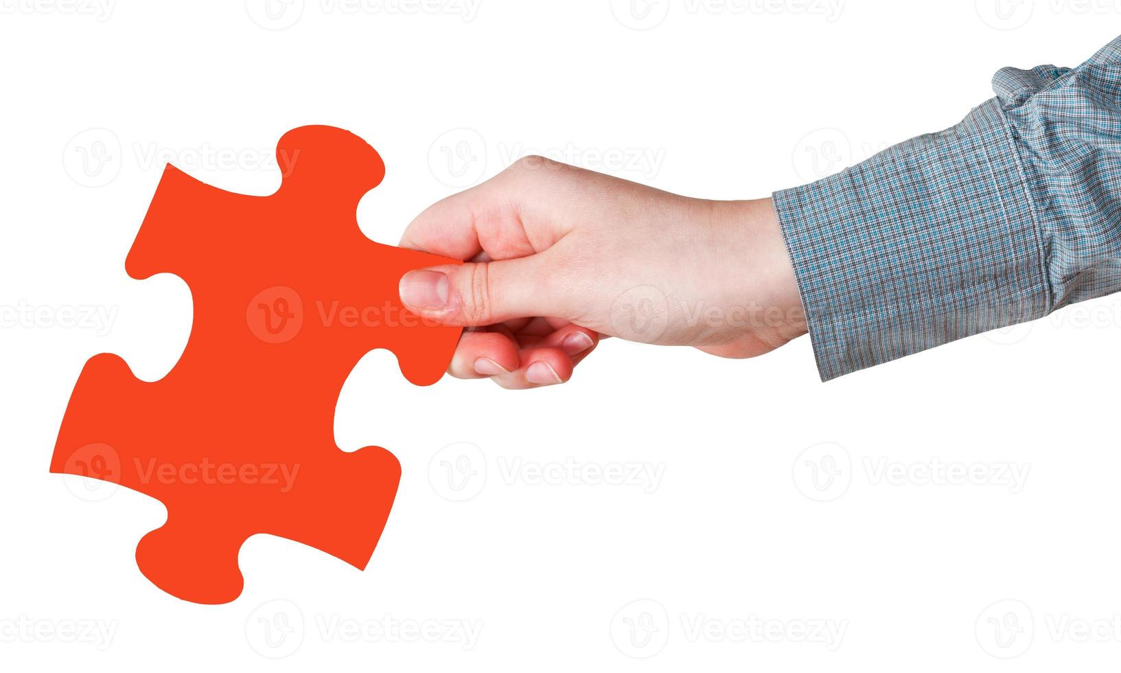 female hand with red puzzle piece photo