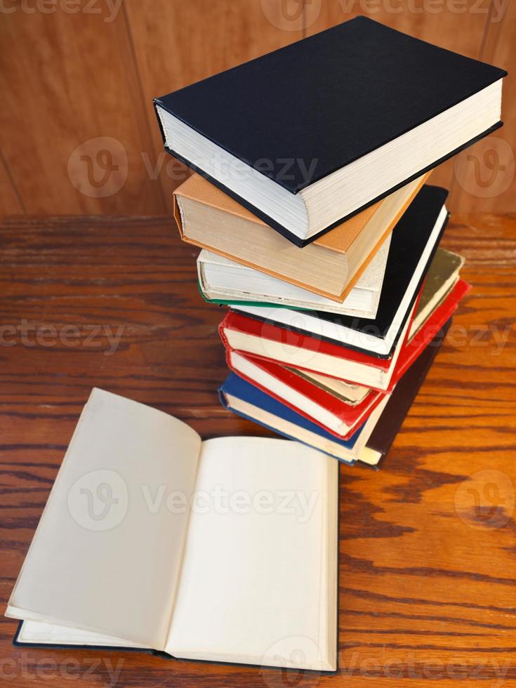 open books on wooden table photo