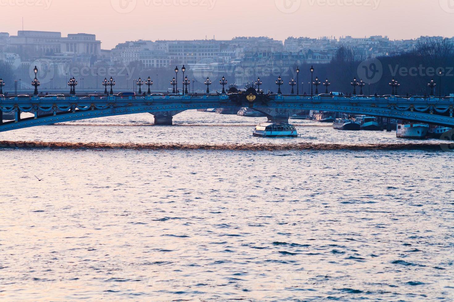 Bridge in Paris on pink blue sunset photo