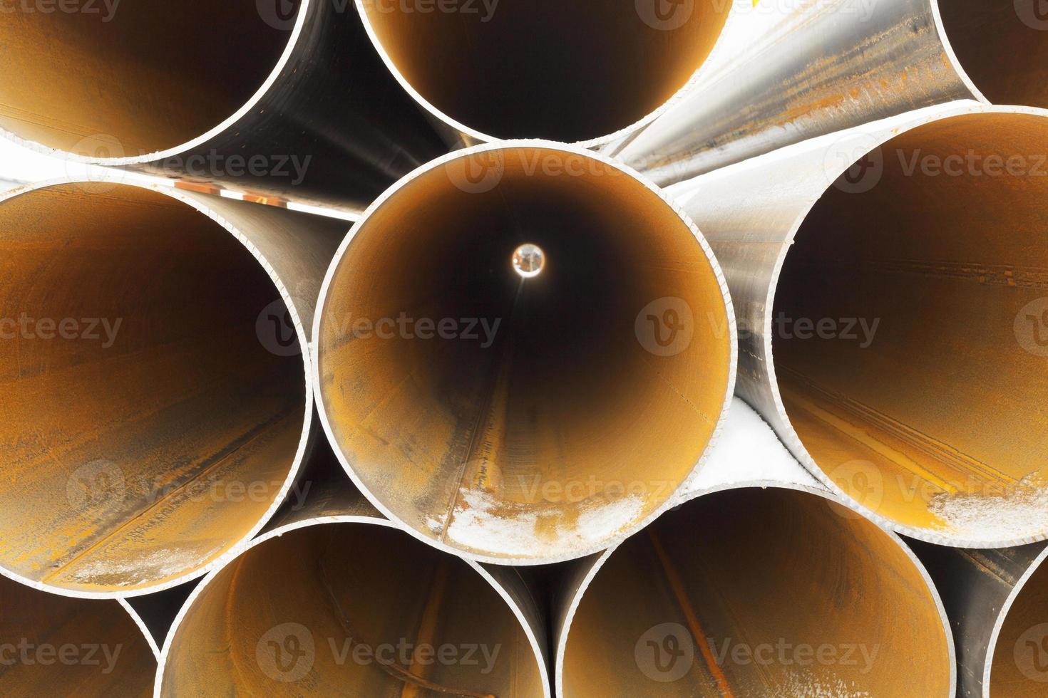 tops of rusty pipes close up photo