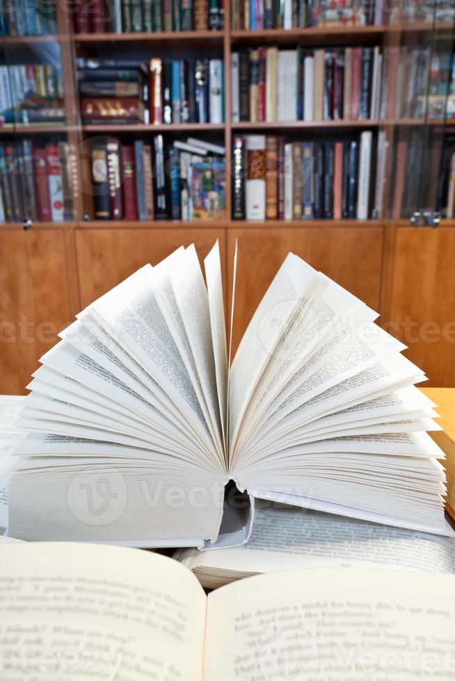 open books on wooden table photo