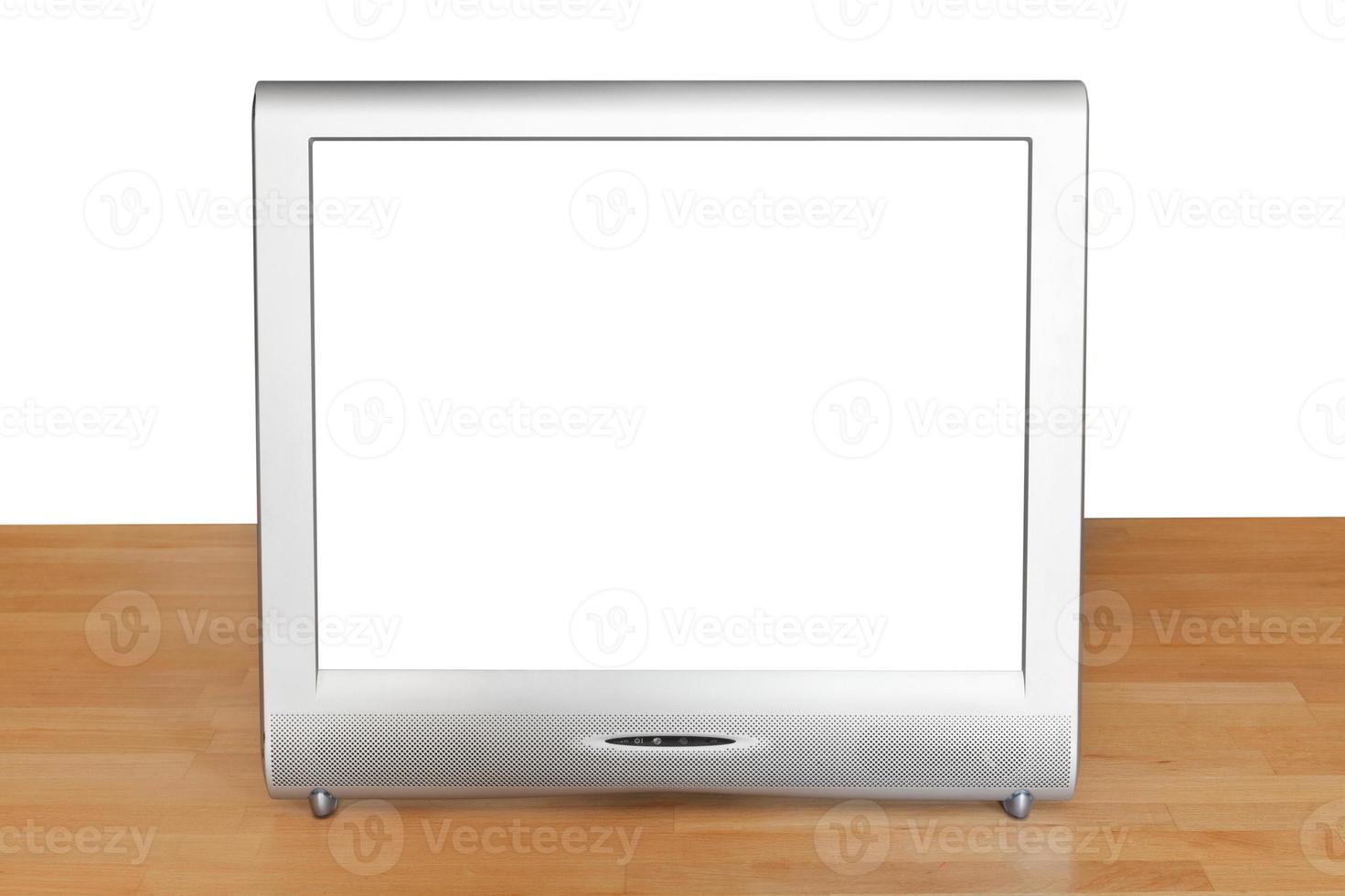 vista frontal de la pantalla gris del televisor en la mesa foto