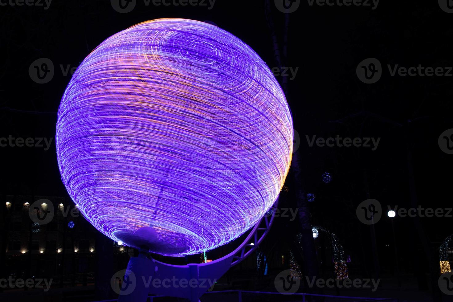 Globe, model of the earth in neon lights at night. photo