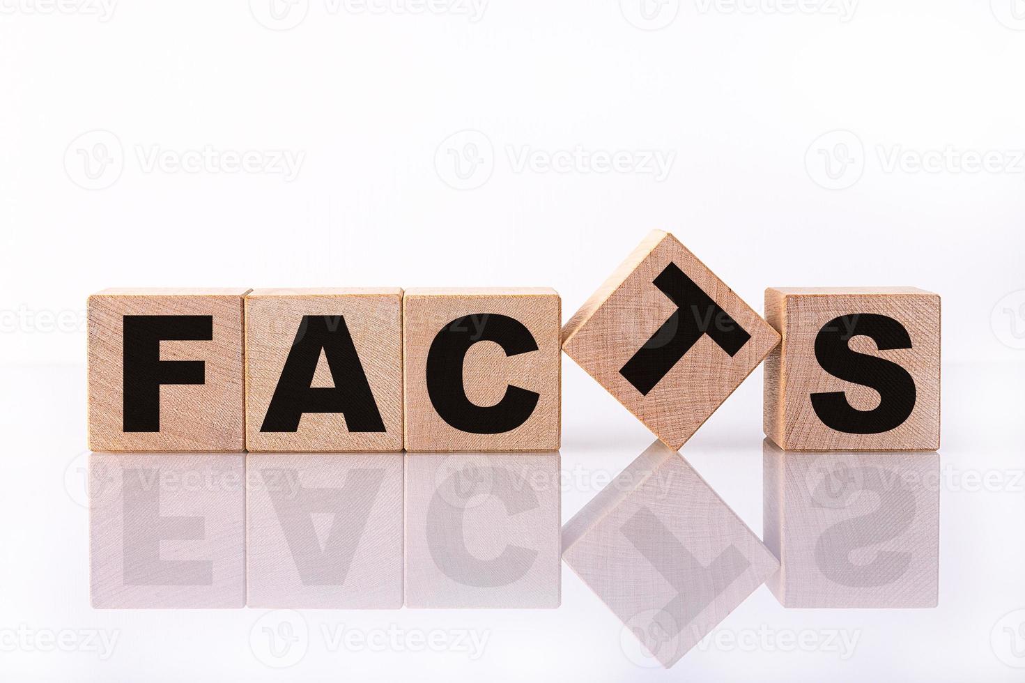 FACTS word, text written on wooden cubes on a white background with