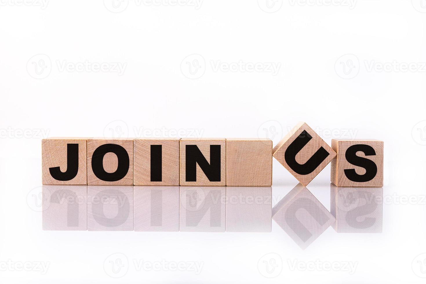 JOIN US word, text, written on wooden cubes, building blocks, over white background with reflection. photo