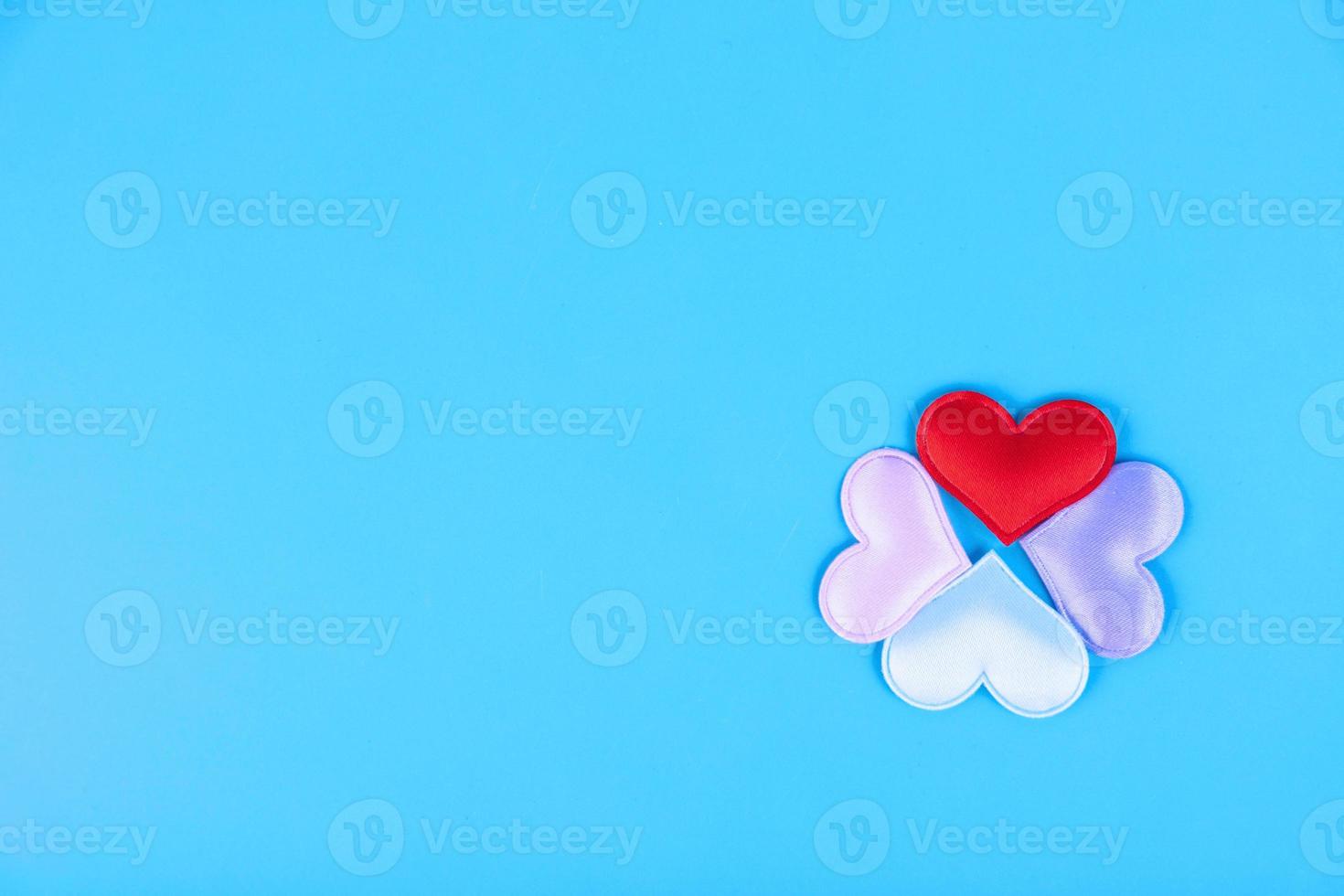 Valentine's Day composition. Hearts on a blue background. View from above. Flat lay. Copy space photo