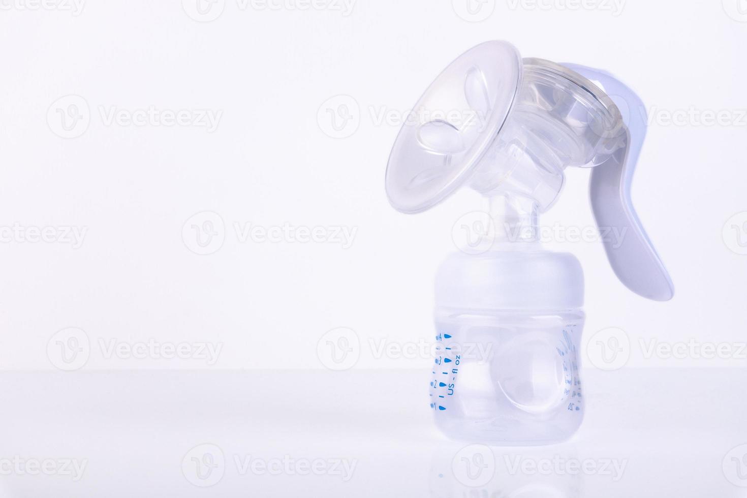 Manual breast pump, on a white background. Copy space photo