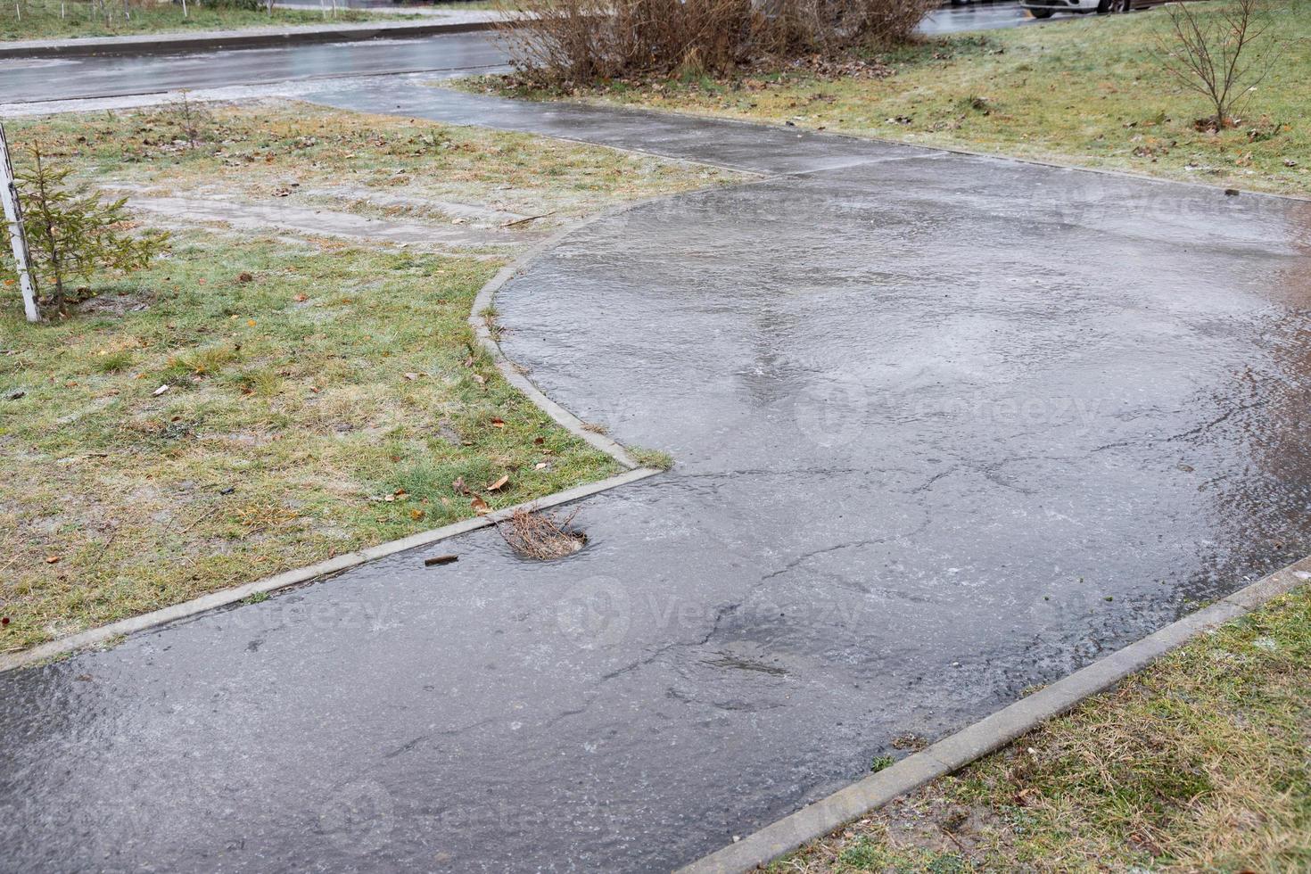 Surface of a snowy, slippery road on a winter day. photo