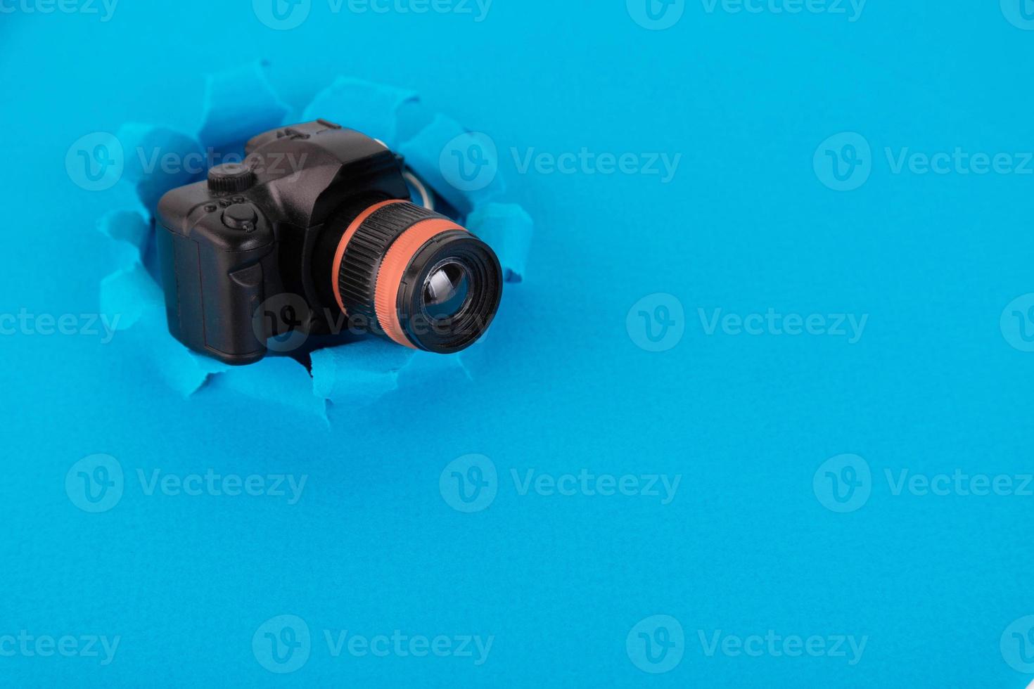 Toy camera on a blue background. Concept. Copy space photo