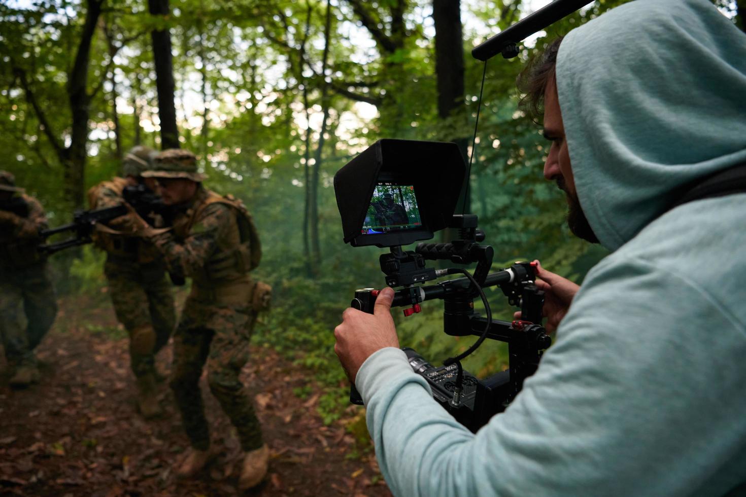 Videographer Taking Action Shoot of Soldiers in Action photo