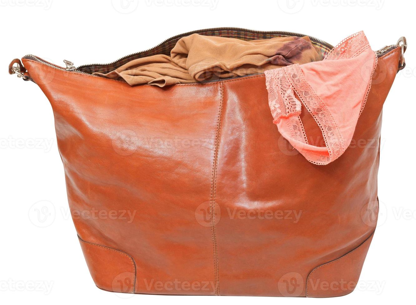 leather handbag with blouse and pink lace panties photo