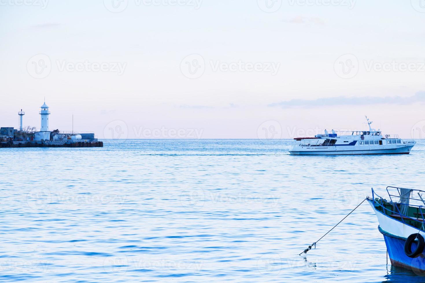 lighthouse and Black Sea in blue evening, Yalta photo