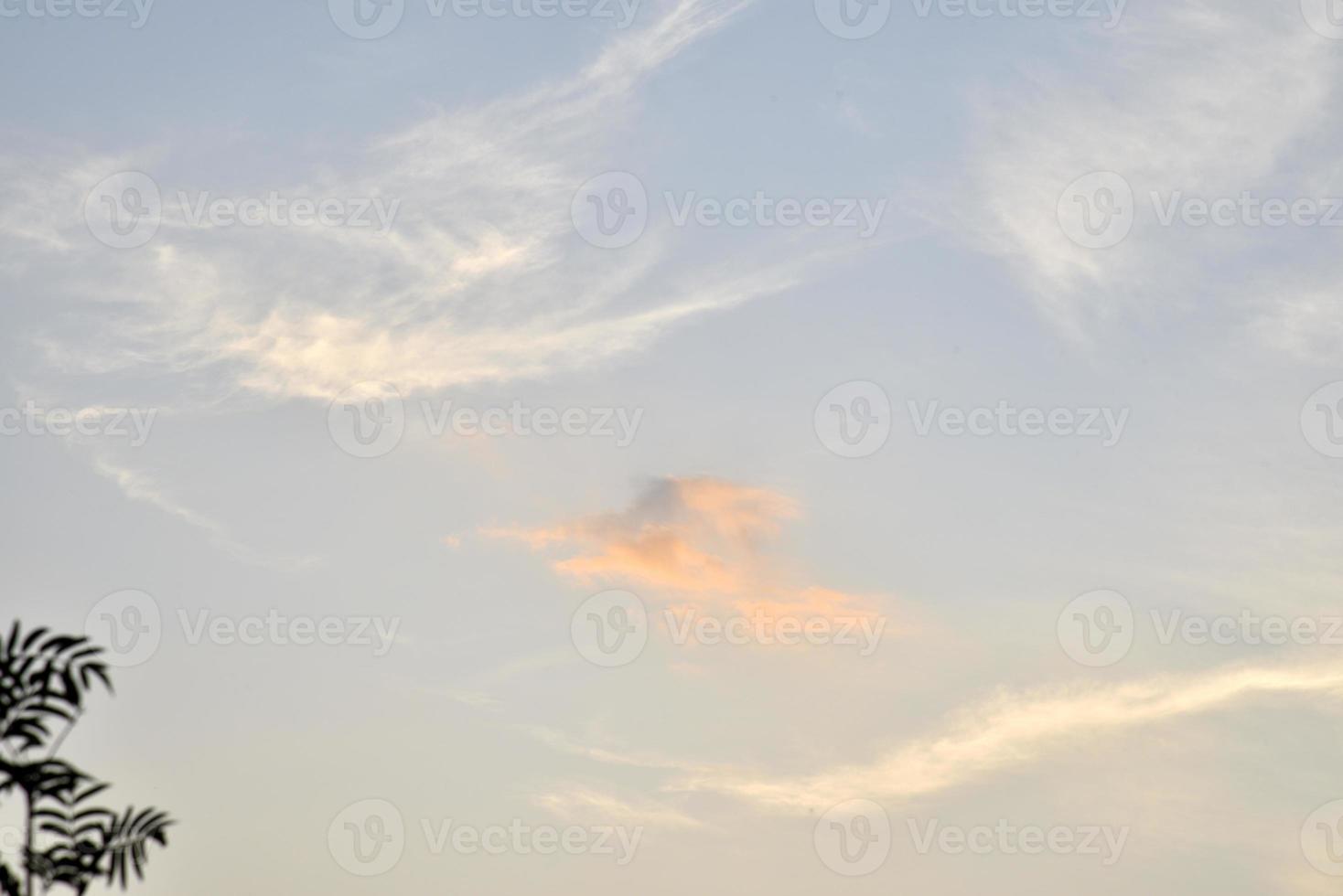 Beautiful sunset sky with delicate pink clouds. Summer sunset landscape. photo