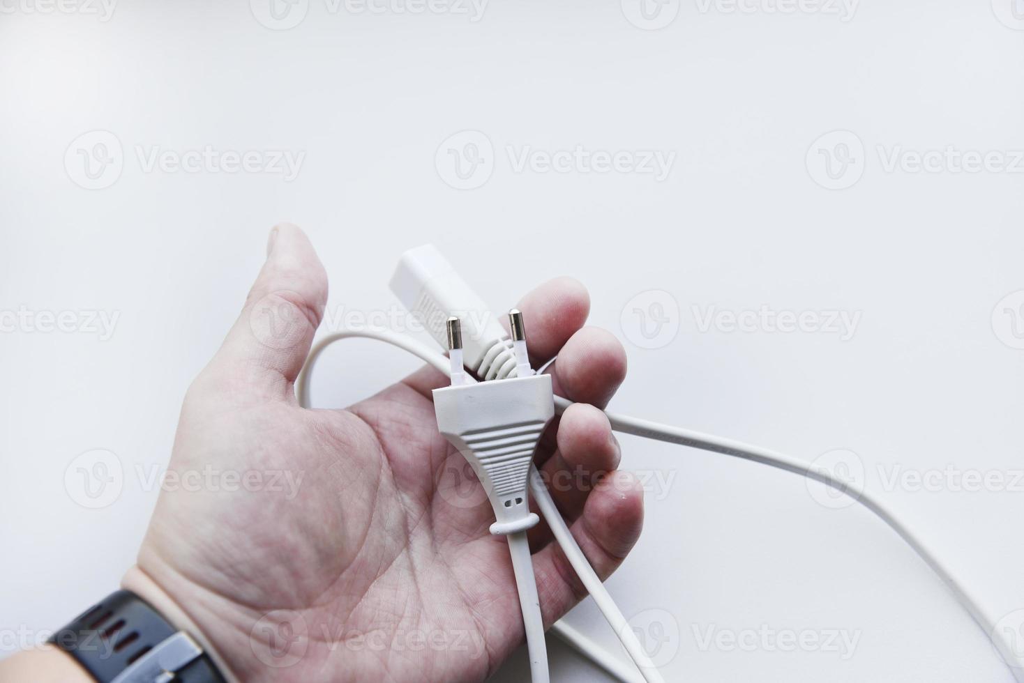 White power cord on a white background. Electric cord on a white background. photo