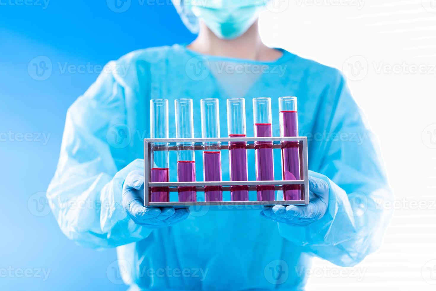 Lab assistant uniform with mask gloves holding test tube with science laboratory research sample while analyzing development on biology chemical as graph growth increase investment revenue, copy space photo