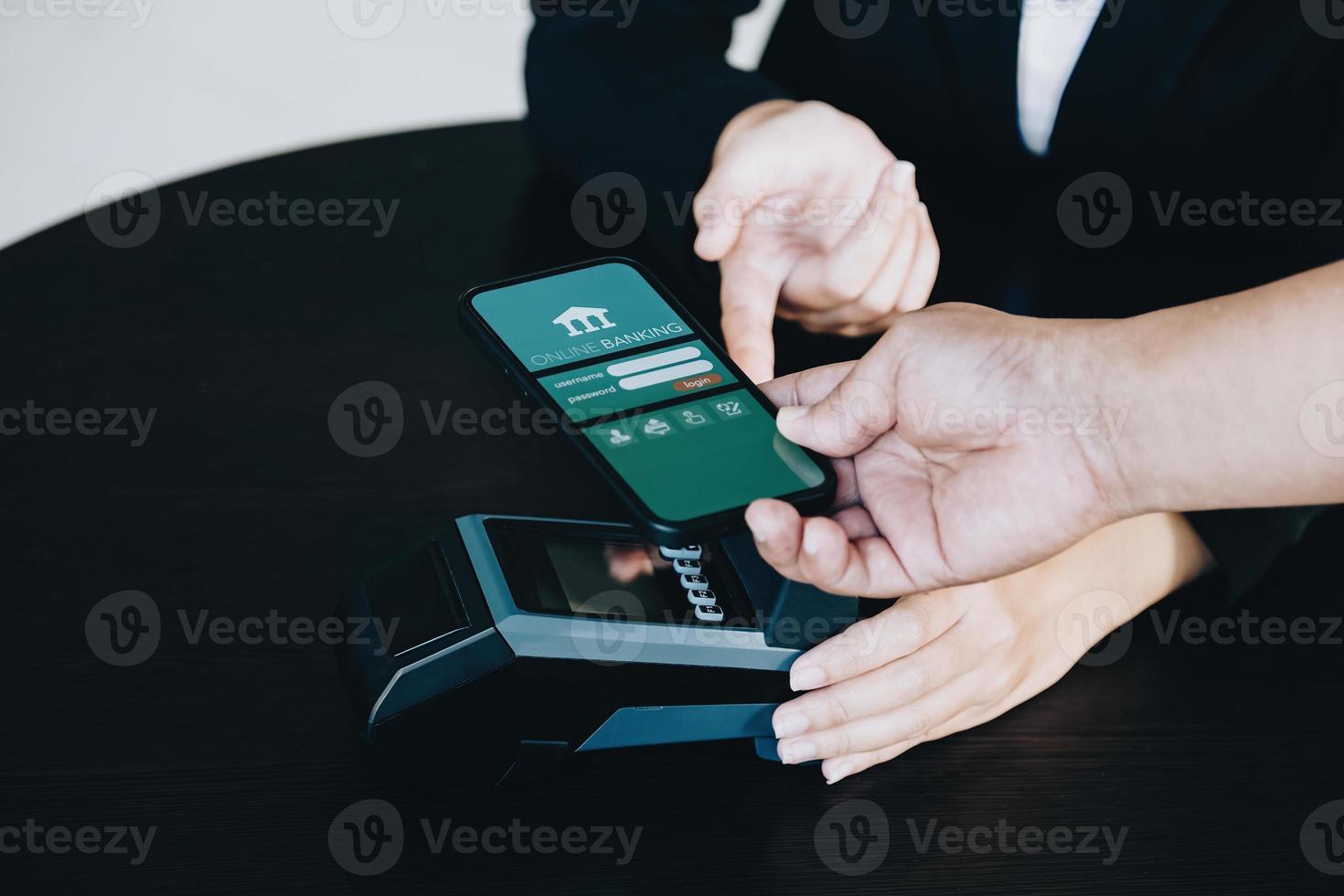 Payment security technology concept and service fees, Employees are holding electronic card machines for customers to use smartphone mobile to pay via paywave technology. photo