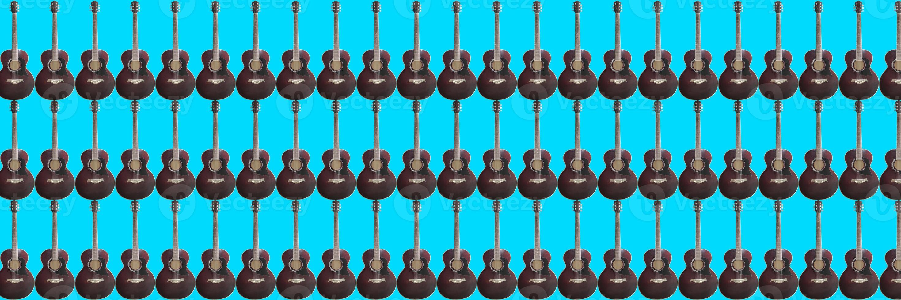 acoustic guitar on blue background photo