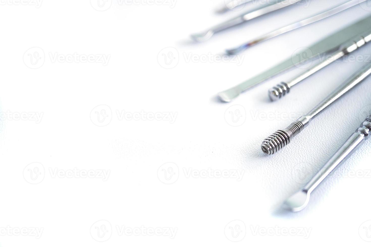 Tool set for cleaning ears isolated on a white background. photo