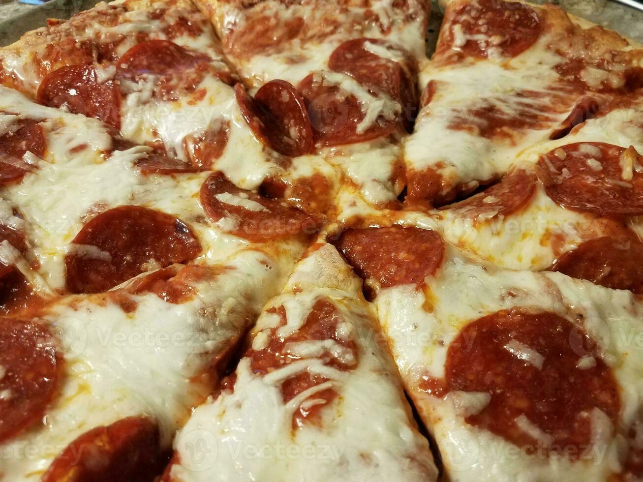 hot pepperoni and melted cheese pizza slices photo