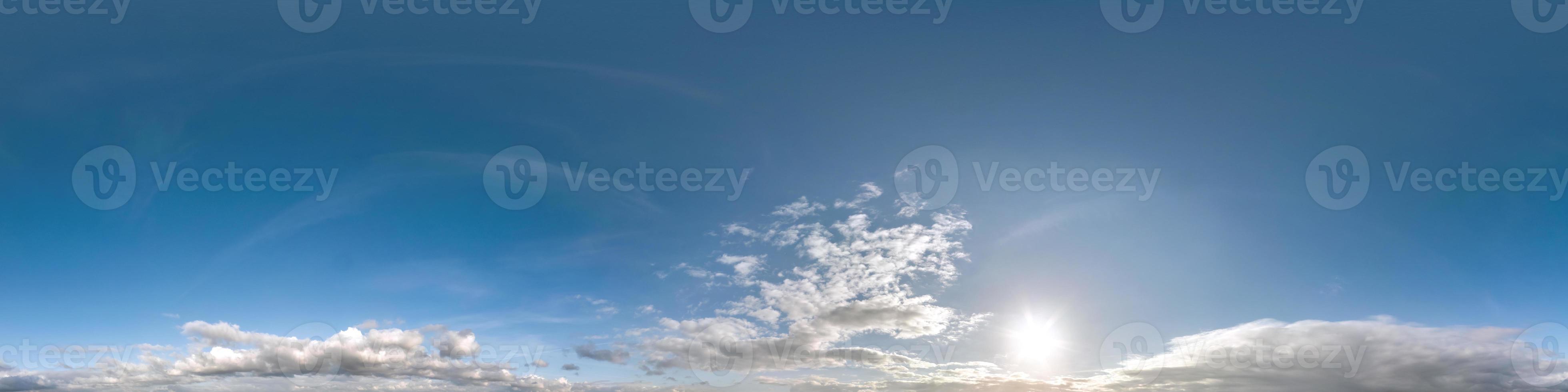 blue sky hdri 360 panorama with white beautiful clouds in seamless projection with zenith for use in 3d graphics or game development as sky dome or edit drone shot for sky replacement photo