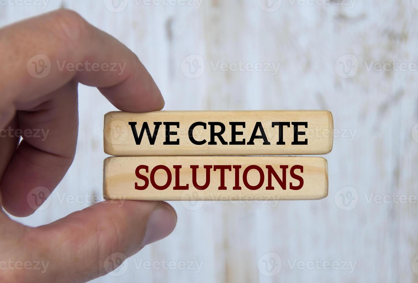 Hand holding wooden blocks with text - We create solutions. Problem ...
