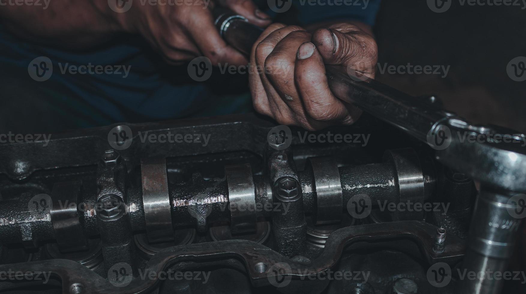 The mechanic is checking the engine. photo