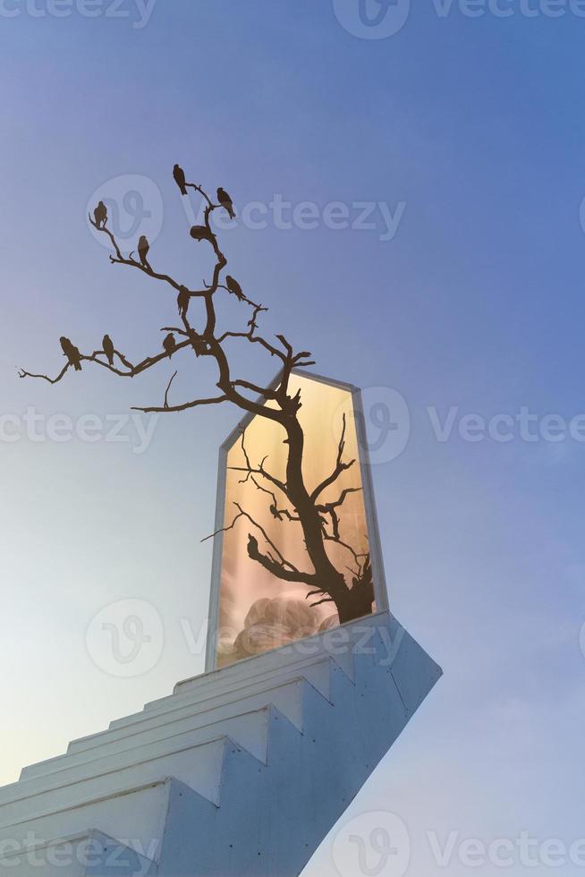 The photograph combines the imagination of a staircase leading up to the sky with a gateway to another beautiful place. and empty space photo