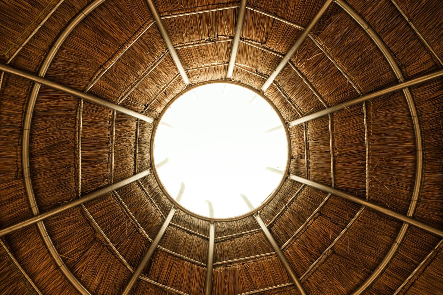 Steel roof trusses with primer paint with a round hole in the center. photo