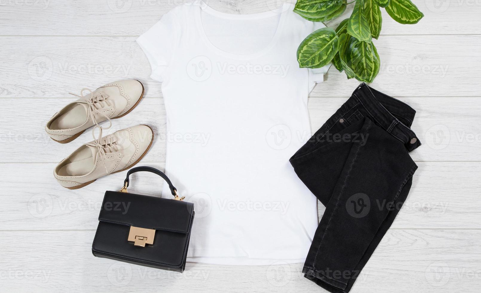 White female t shirt outfit mock up flat lay on wooden background. Top view and copy space. Mockup t-shirt and summertime. Template blank shirt. Outfit set photo