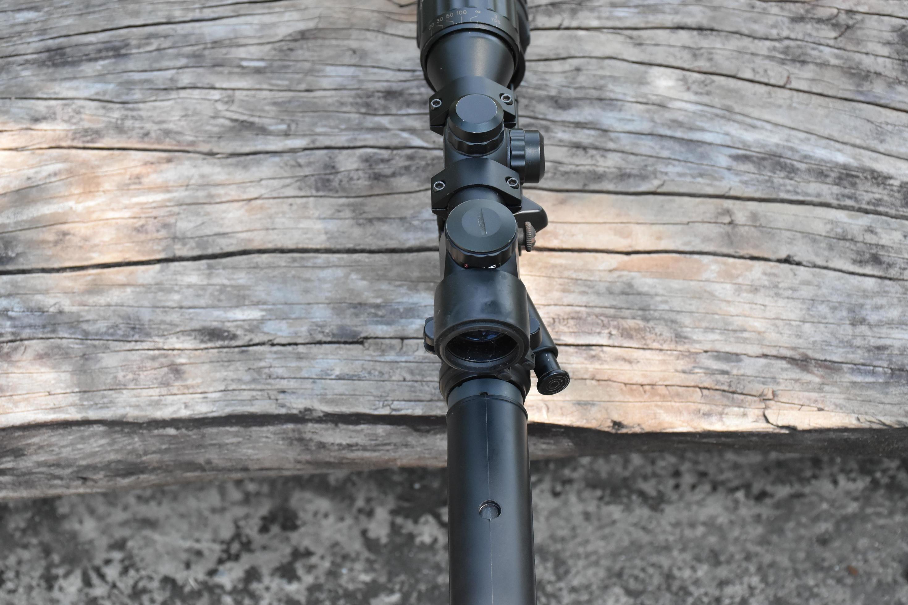 Binoculars of black automatic rifle Longbarreled at the training