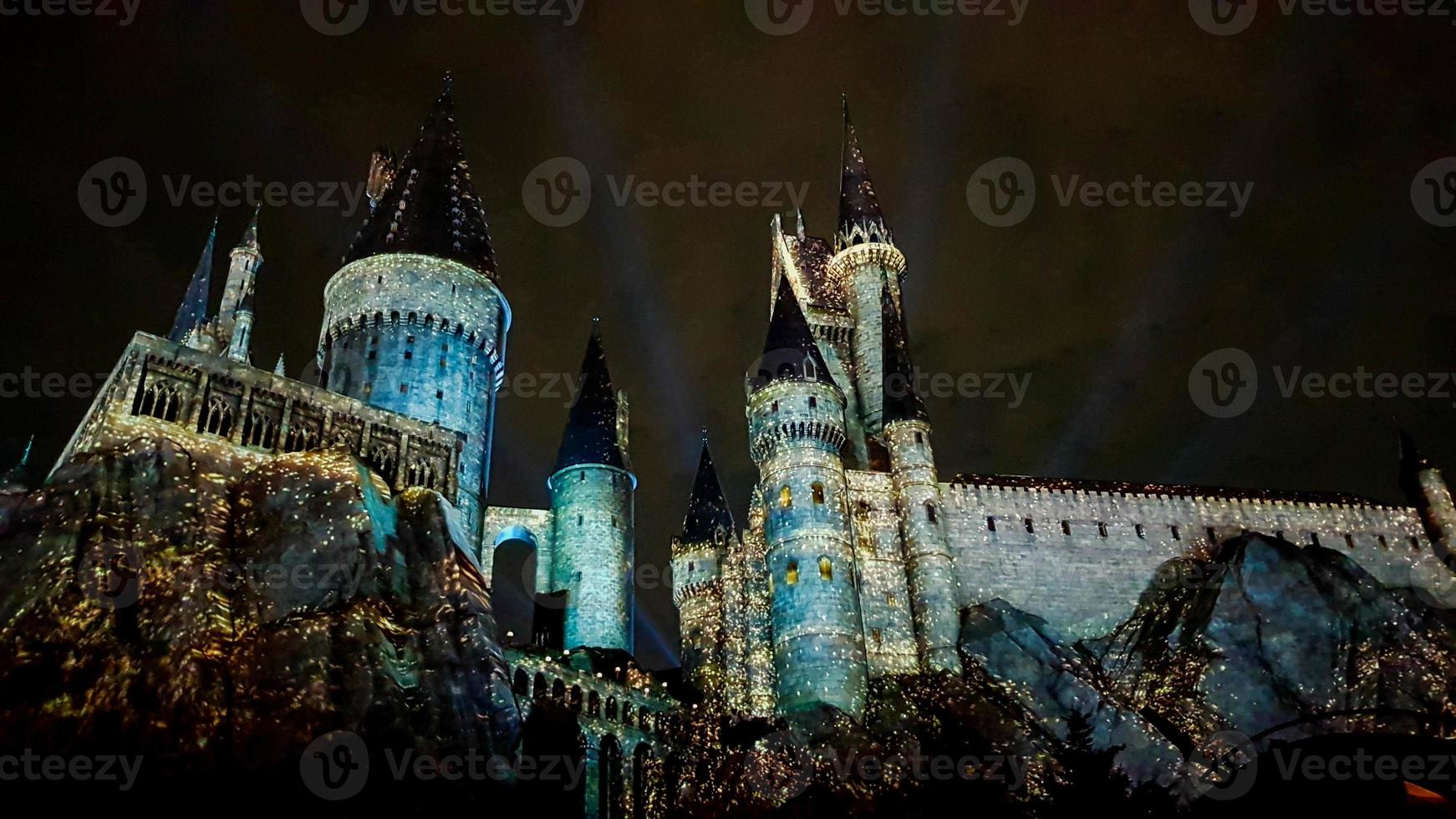 Osaka, Japan on July 8, 2019. A very beautiful light show at night at Hogwarts Castle featuring the four dormitories. photo